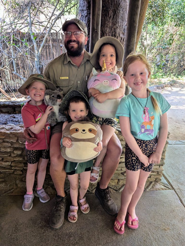 Four kids with safari guide at lodge in south africa